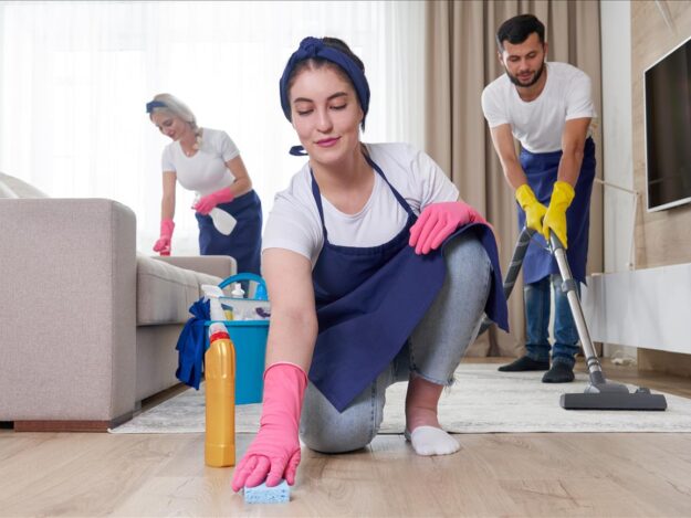 professional-cleaning-service-team-cleans-living-room-modern-apartment